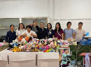 Volunteers with donated stuffed toys for children at a HOPE event
